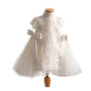 Beautiful lace dress with oversized bows.